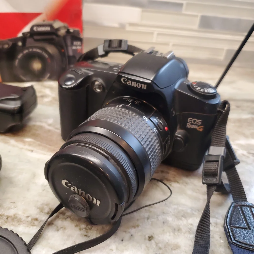 Canon EOS Elan 7 and EOS Rebel G With Lens And Accessories (see notes)